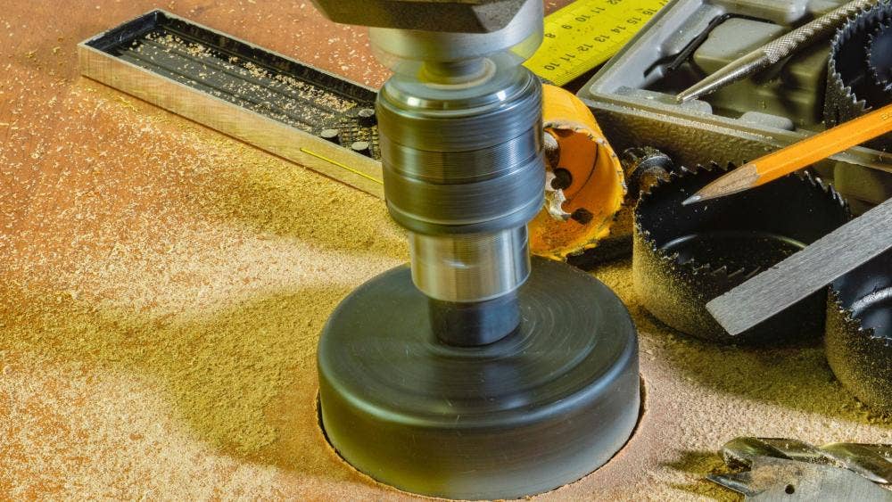 Hole saw in use on wood