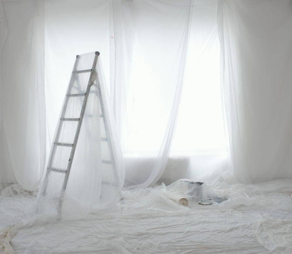 Dust sheets in a room with ladders