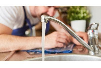 Man fixing a tap