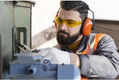 Man is safety gear using power tools