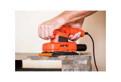 Electric sanding tool in use