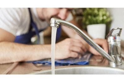 Man fixing a tap
